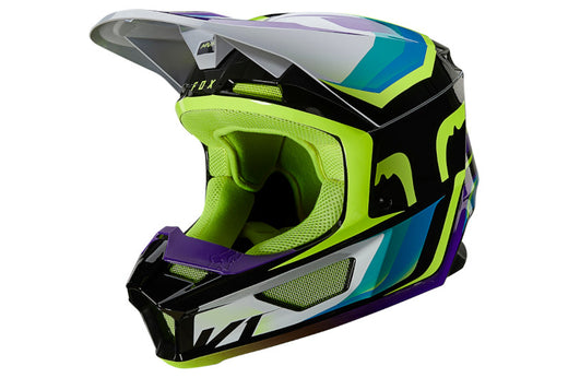 Kask motocrossowy w jaskrawym malowaniu z daszkiem, kask szczękowy do enduro i crossa, kask FOX, prezentowany bokiem na białym tle